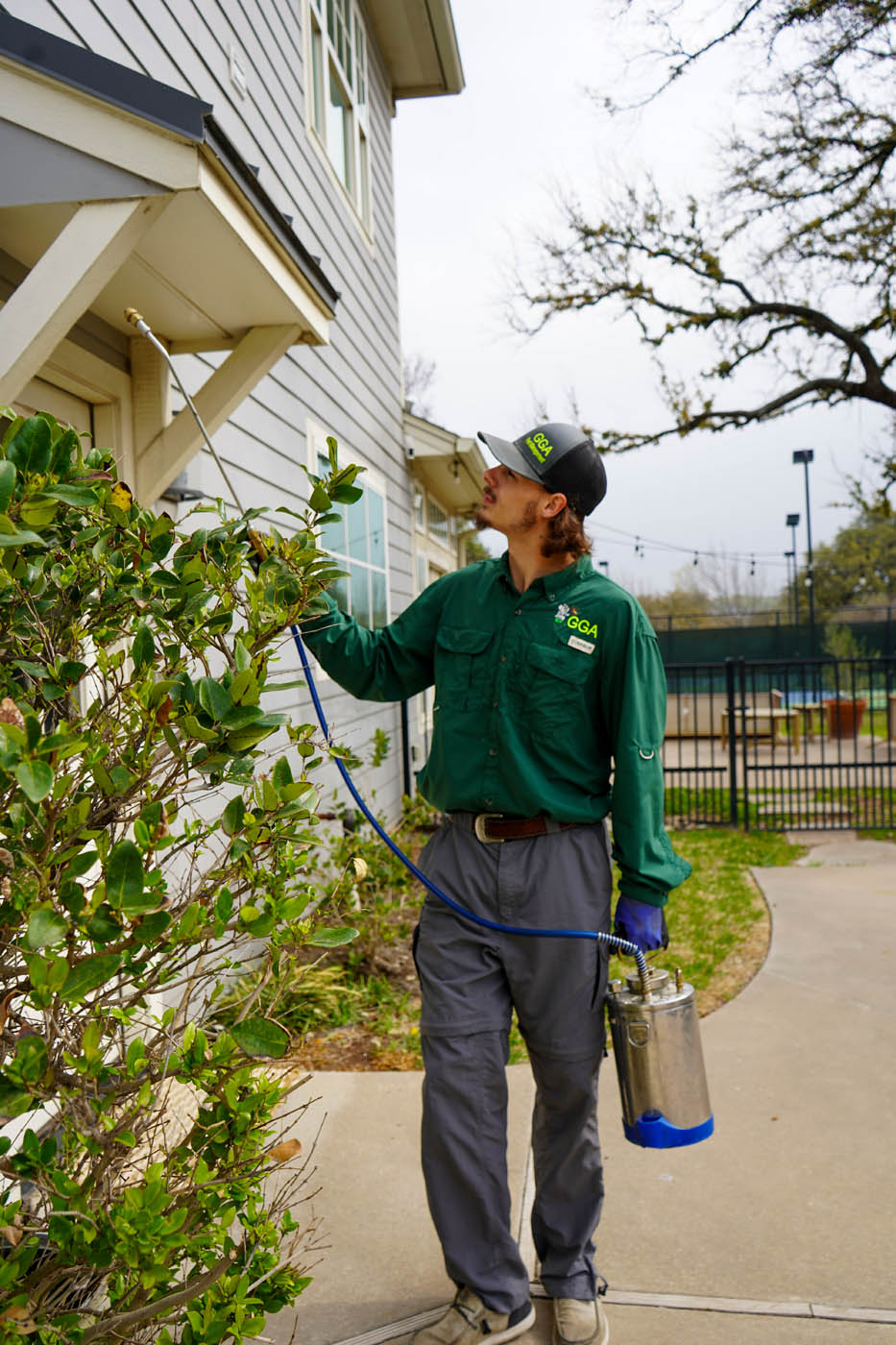 A GGA Pest Management employee working on residential home - choose GGA Pest Management for the best Temple exterminator pest control services.