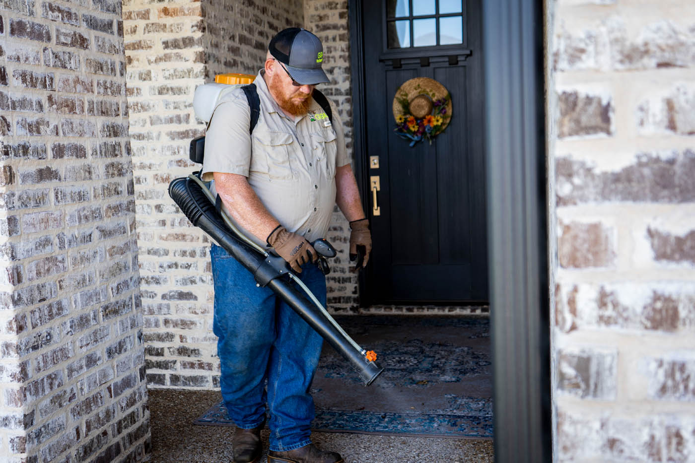 A Killeen, TX technician working on spraying a residential home.