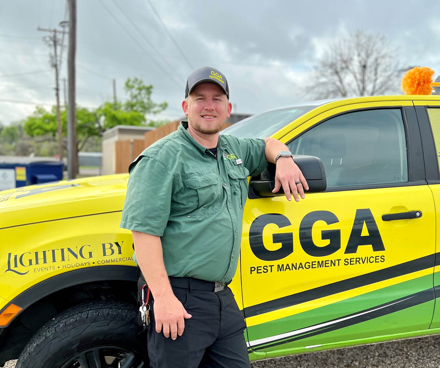 A GGA Pest Management professional standing in front of a vehicle - learn how we can help with the best bed bug exterminator services.