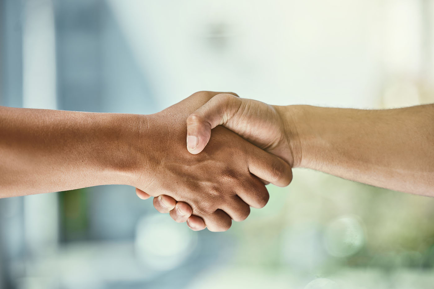 An image of two people shaking hands - take part in our customer referral program and get a special thank you from GGA Pest Management today.